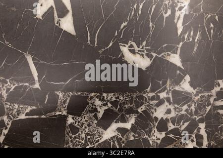 Elegant black and white marble surface displaying unique veining patterns in a modern interior setting Stock Photo