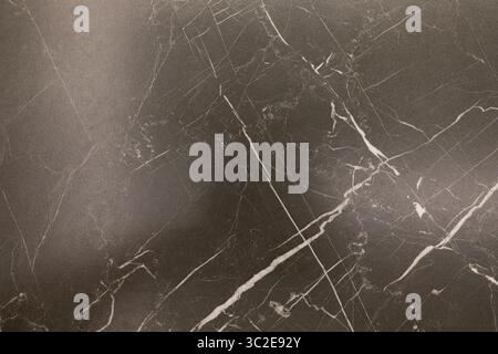 Dark marble surface featuring intricate white veining patterns creating an elegant backdrop for various decorative projects Stock Photo