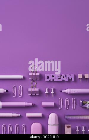Monochrome banner with violet stationery felt-tip pens, markers, clips, paper clips, pins on purple background. Place for your text Stock Photo