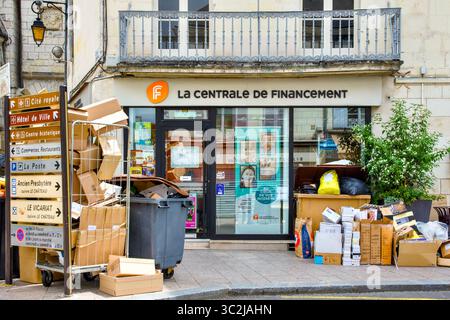 Empty boxes, cartons and rubbish awaiting collection by refuse contractors outside local finance premises - Loches, Indre-et-Loire (37), France. Stock Photo