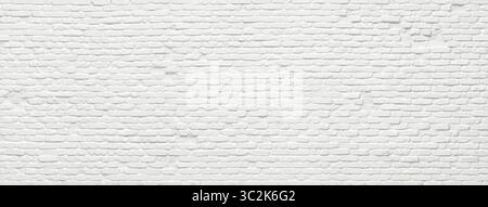white brick wall, masonry pattern of painted stone and concrete Stock Photo