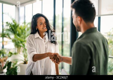 Diverse multiethnic business people, handshake for agreement, b2b deal and cooperation for project Stock Photo