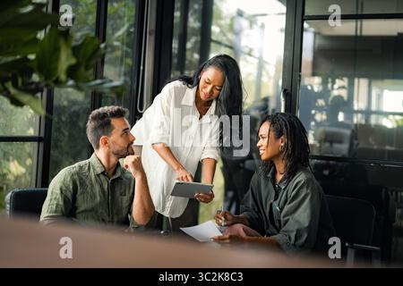 Team of industrial design agency specialists, software engineer programmers discussing in office Stock Photo