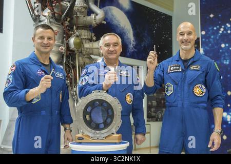 July 16, 2019 - Baikonur, Kazakhstan - International Space Station Expedition 60 prime crew members Drew Morgan of NASA (left), Alexander Skvortsov of Roscosmos, (center) and Luca Parmitano of the European Space Agency, (right) pose holding replicas of launch keys used to ignite the rocket at the Baikonur Cosmodrome July 16, 2019 in Baikonur, Kazakhstan. Morgan, Skvotsov and Parmitano are expected to launch July 20th on the Soyuz MS-13 spacecraft to the International Space Station. (Credit Image: © Andrey Shelepin via ZUMA Wire) Stock Photo