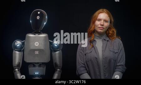 Visualization of Futuristic People and Robots Concept: VFX Animation of High-Tech Humanoid Robot Prototype of Young Woman. Connection and Collaboration Between Humanity and Artificial Intelligence. Stock Photo