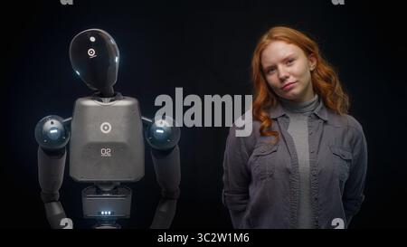 Visualization of Futuristic People and Robots Concept: VFX Animation of High-Tech Humanoid Robot Prototype of Young Woman. Connection and Collaboration Between Humanity and Artificial Intelligence. Stock Photo