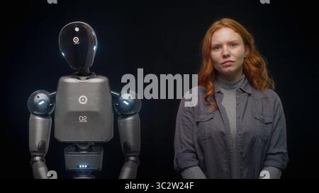 Visualization of Futuristic People and Robots Concept: VFX Animation of High-Tech Humanoid Robot Prototype of Young Woman. Connection and Collaboration Between Humanity and Artificial Intelligence. Stock Photo