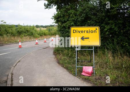 Use Alternative Roat Sign Alternative route. Temporary road sign redirecting traffic along ...