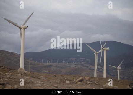 August 8, 2019, Manjil, Gilan, IRAN: A view of Manjil and Rudbar Wind Farm in Manjil, Gilan province, Iran. Manjil, Harzvil, Siahpoush and Rudbar Wind Farms are wind farms located in Gilan, Iran. In 1995 the Iranian governors decided to use renewable energies in Iran and started to develop wind farms in Manjil area. They start with installing a Nord Tank NTK-500/37 wind turbine. They added other products of Nordtank such as NTK-300/35 and NTK-550/42. The developer was Iran Renewable energies organization (SUNA) as representative of TAVANIR, and they chose Saba-Niroo as Iranian manufacturer to Stock Photo