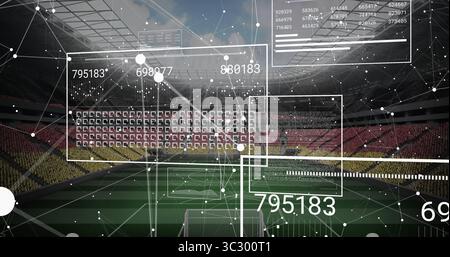 Displaying augmented reality data floating above pitch at soccer stadium, with goalposts and charts Stock Photo