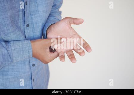 closeup of man suffering pain in his hand  Stock Photo
