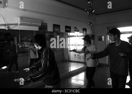 Early-2000s Chinese Teenagers Practicing Street Dance in Mirror Studio Stock Photo