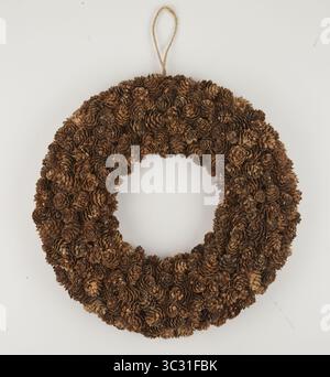 circle of dried pine flowers with a hanging rope isolated nature background with clipping path Stock Photo