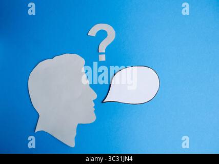 Human Head Silhouette with Blank Speech Bubble and Question Mark Stock Photo