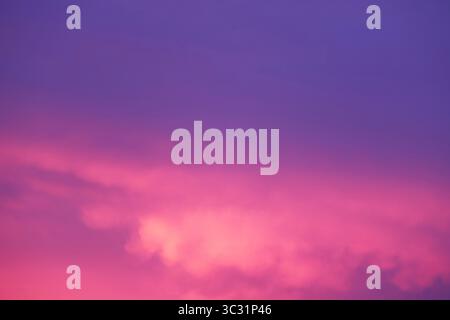 Purple Blue Dusk Sky with Orchid Pink Afterglow Reflecting on the Clouds Stock Photo
