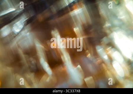 Soft glowing light trails in shades of amber, gold, and white, captured with motion blur. Stock Photo