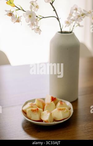 Fresh Cut Peaches in Wabi Sabi Aesthetic Stock Photo
