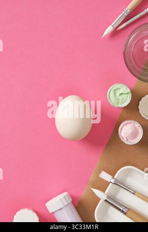 Preparing for Easter celebrations. Coloring Easter eggs with gouache. Clean light colored eggshells for your design. Stock Photo