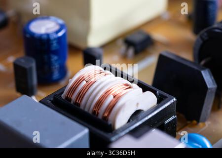 Close up of electronic components in television, electromagnetic interference filter with plastic core Stock Photo