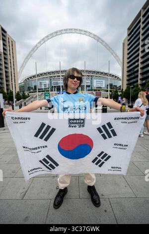 London, UK.  25 July 2025.  Seop from near Seoul, South Korea, arrives for tonight’s Oasis concert at Wembley Stadium, the first time that the band has played in the capital for 16 years.  The band will play seven dates across July to September at Wembley Stadium as part of their Live ’25 Tour, with the final show on 28 September. Aged 29, he quit his job to embark on a 50 day visit to the UK, to see Oasis at each of their show locations in the UK.  He has also seen Ed Sheeran and Bille Eilish in concert during this trip.   Credit: Stephen Chung / Ģ����ý Live News Stock Photo