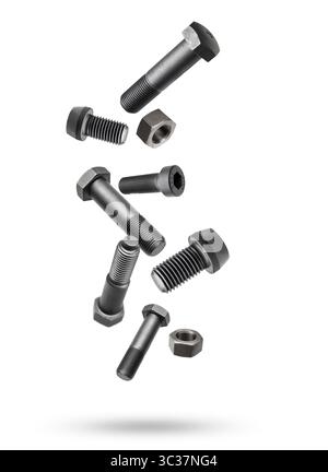 Variety of large black steel screws and bolts flying on white background. Stock Photo