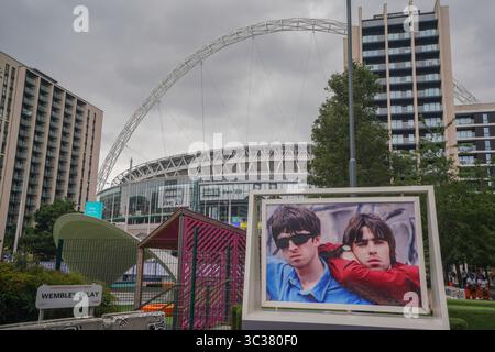 London, UK. 25 July 2025  A picture  displayed in Wembley Splay of Noel and Liam Gallagher of Oasis  ahead of tonights's concert at Wembley stadium. This is the first time in 16 years Oasis  band will perform in London and  will play seven  concert dates from  July to September  with the final show on 28 September as  part of their Live ’25 Tour  .Amer Ghazzal/Alamy Live News Stock Photo