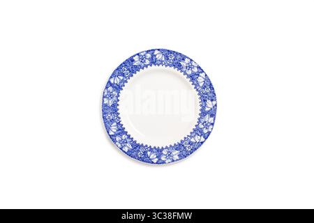 A blue and white england style ceramic round plate on a white background in a top view Stock Photo