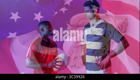 Displaying rival athletes facing each other in studio, with football, baseball glove and flag motif Stock Photo