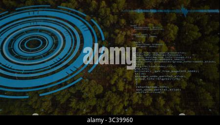 Displaying evergreen canopy covering aerial view, with blue circular HUD, code and grid overlays Stock Photo