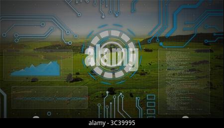 Displaying HUD interface on hillside pasture featuring circuit traces, chart waveform code panels Stock Photo