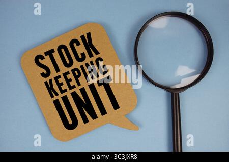 Stock Keeping Unit text with magnifying glass on blue background Stock Photo