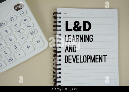 L&D Learning and Development text with calculator phrase of business and financial concept Stock Photo