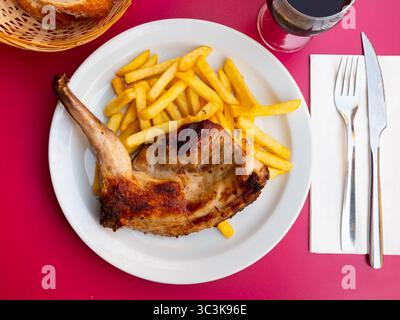 Braised rabbit served with potato garnish Stock Photo