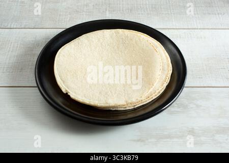 A view of a stack of corn tortillas on a plate. Stock Photo