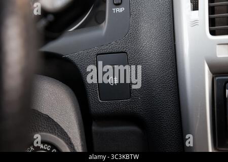 Close-up on the headlight switch control buttons and automatic adjust level dashboard of car in the vehicle. Auto service industry Stock Photo