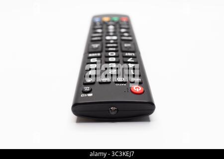 Black Remote with Red Power Button Close up Stock Photo