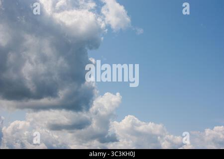 Bright blue sky, white clouds floating in the sky. Stock Photo