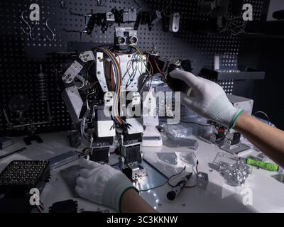 Repair the robot on the workbench Stock Photo