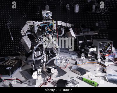 Repair the robot on the workbench Stock Photo
