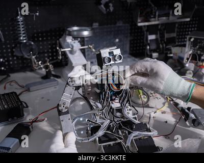 Repair the robot on the workbench Stock Photo