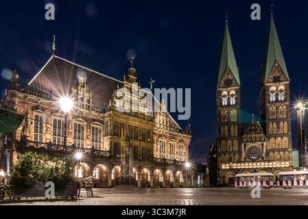 Beautiful view of the market square in Bremen at night, illuminated by street lamps and  by the famous landmarks Bremen City Hall and the cathedral... Stock Photo