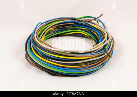 Roll of multicolored electric cables isolated on white background Stock Photo