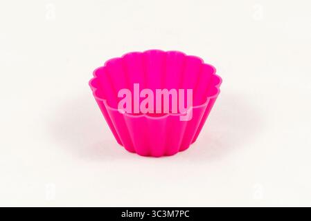 Pink silicone cake cups isolated on white background Stock Photo