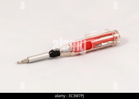 Multi-bit red mini screwdriver, isolated on white background Stock Photo