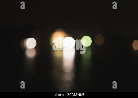 An artistic representation of blurred circular lights, capturing the enchanting magic of bokeh. The abstract composition features soft glows in a capt Stock Photo