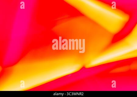 Vibrant abstract image capturing dynamic movement using long exposure. The blend of red and yellow hues creates a vivid, energetic feel, perfect for c Stock Photo