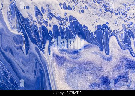 Beautiful abstract acrylic paint background featuring flowing blue tones. This image showcases intricate patterns and textures, creating an exquisite Stock Photo