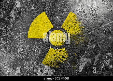 Radioactive sign on grey textured surface. Radiological pollution Stock Photo