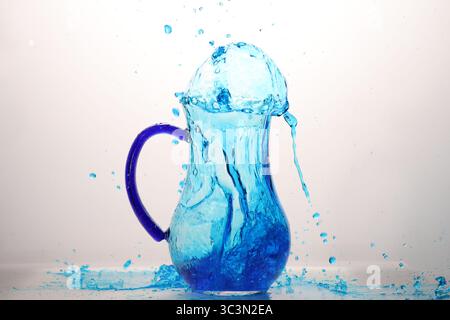 blue water explosion in glass jar Stock Photo