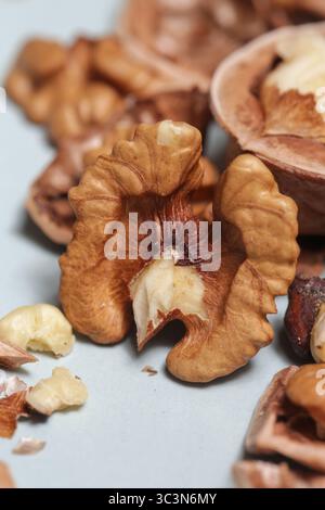 Whole and cracked walnuts and nutcracker Stock Photo